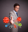 Attractive man throwing dices and chips