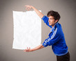 Young boy holding crumpled white paper copy space