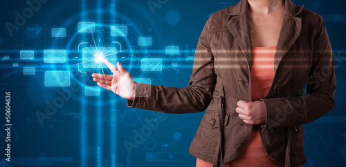 Photo: Woman pressing high tech type of modern buttons Woman pressing high tech type of modern buttons