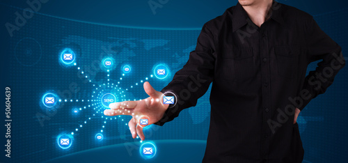 Photo: Businessman pressing virtual messaging type of icons Businessman pressing virtual messaging type of icons