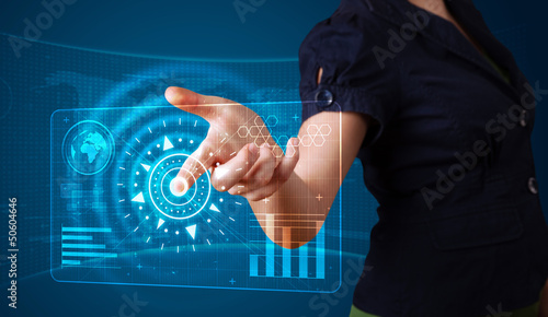 Photo: Woman pressing high tech type of modern buttons Woman pressing high tech type of modern buttons