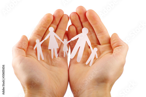 Photo: Paper family in hands isolated on white background Paper family in hands isolated on white background