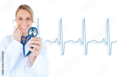 Photo: Blonde doctor holding up stethoscope Blonde doctor holding up stethoscope
