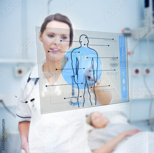 Illustration: Nurse touching screen displaying blue human form Nurse touching screen displaying blue human form
