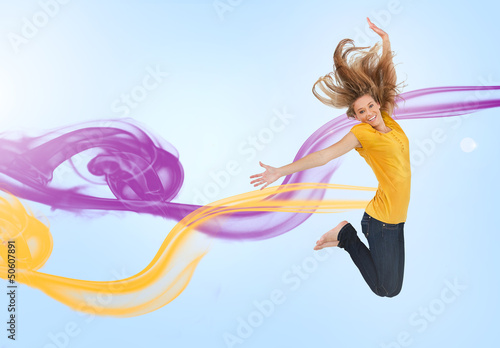 Photo: Pretty girl jumping for joy Pretty girl jumping for joy