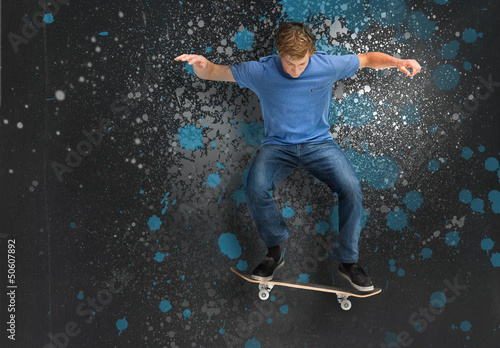 Photo: Cool young skateboarder doing an ollie trick Cool young skateboarder doing an ollie trick
