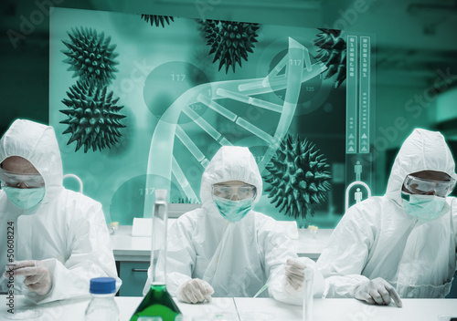 Photo: Scientists working in protective suite with futuristic interface Scientists working in protective suite with futuristic interface
