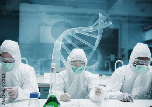 Photo: Chemists working in the lab with futuristic interface Chemists working in the lab with futuristic interface