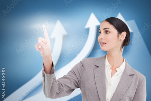 Photo: Businesswoman using transparent futuristic interface Businesswoman using transparent futuristic interface