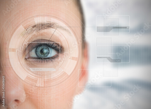 Photo: Close up of woman blue eye analyzing chart interfaces Close up of woman blue eye analyzing chart interfaces