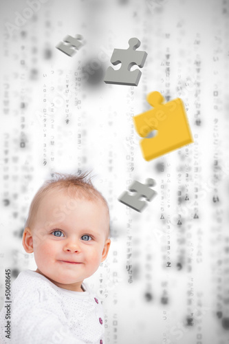 Photo: Jigsaw pieces floating around a baby Jigsaw pieces floating around a baby