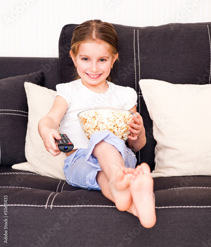 Photo: little girl watching TV little girl watching TV
