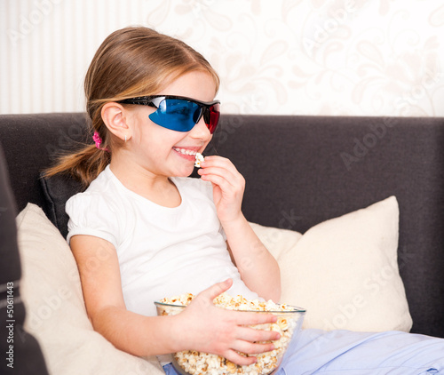 Photo: little girl watching TV little girl watching TV