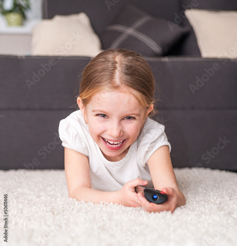 Photo: little girl watching TV little girl watching TV