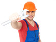 Photo: smiling worker with big spanner smiling worker with big spanner