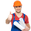 Photo: handyman with paper showing thumbs up sign handyman with paper showing thumbs up sign