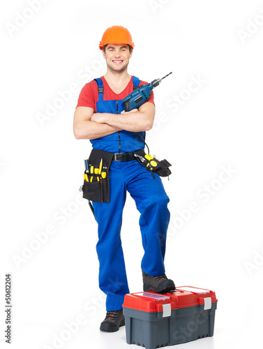 Photo: Handyman with tools full portrait isolated Handyman with tools full portrait isolated