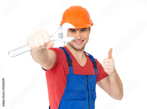 Photo: Worker with spanner showing thumbs up sign Worker with spanner showing thumbs up sign