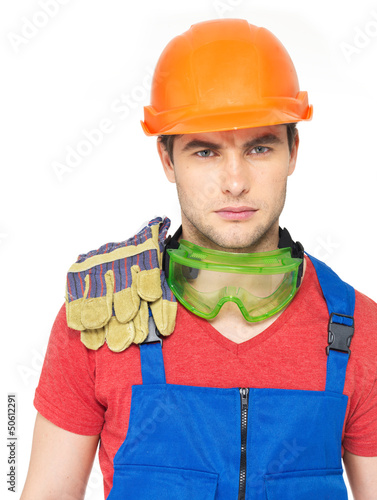 Photo: portrait of serious worker in uniform portrait of serious worker in uniform