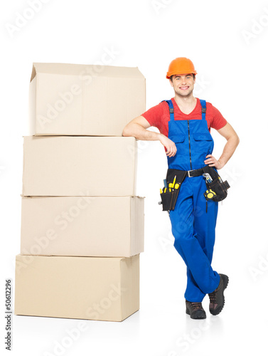 Photo: delivery worker man with paper boxes delivery worker man with paper boxes