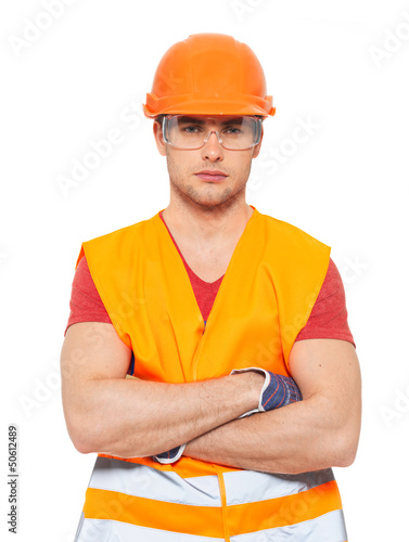 Photo: portrait of thinking handyman in orange uniform portrait of thinking handyman in orange uniform