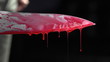 Close up of knife with blood dripping
