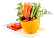 Assorted raw vegetables sticks in pepper bowl isolated on white
