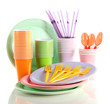 Multicolored plastic tableware isolated on white
