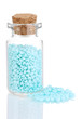 Little bottle full with colorful beads isolated on white