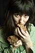 beggar woman eating bread