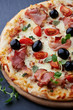 Pizza with smoked ham and olives