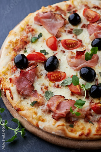 Photo: Pizza with smoked ham and olives Pizza with smoked ham and olives