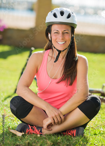 Photo: Cyclist Woman Listening To Music Cyclist Woman Listening To Music