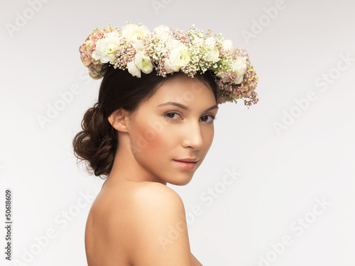 Photo: woman wearing wreath of flowers woman wearing wreath of flowers
