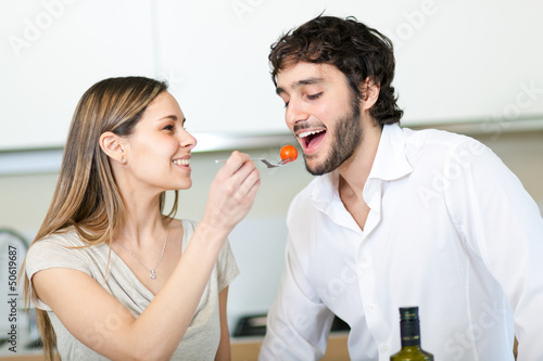 Photo: Cooking.Happy Couple Cooking Together Cooking.Happy Couple Cooking Together