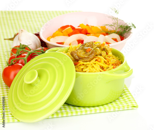 Photo: Delicious pilaf with vegetables isolated on white Delicious pilaf with vegetables isolated on white