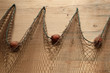 Fishing net is hanging on the wall