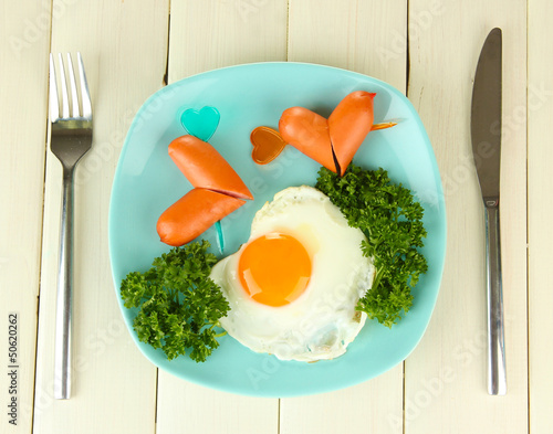 Photo: Sausages in form of hearts, scrambled eggs and parsley, Sausages in form of hearts, scrambled eggs and parsley,