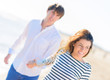 Happy Young Couple On Beach