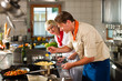 Foto: Chefs in a restaurant or hotel kitchen cooking Chefs in a restaurant or hotel kitchen cooking