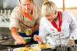 Foto: Chefs in a restaurant or hotel kitchen cooking Chefs in a restaurant or hotel kitchen cooking