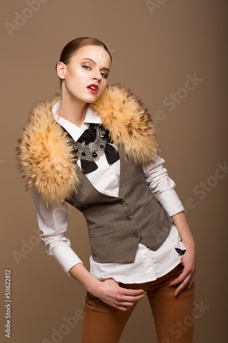 Photo: Perfect Arrogant Woman in Grey Waistcoat and Fur Collar Perfect Arrogant Woman in Grey Waistcoat and Fur Collar
