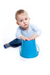 Boy playing with a bucket
