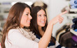 Two Women Shopping In Mall