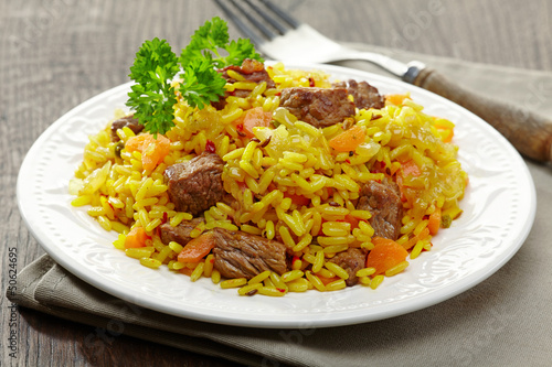 Photo: Uzbek national dish plov on plate Uzbek national dish plov on plate