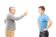 Angry father reprimanding his son with finger