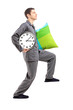 Full length portrait of a sleepwalker with a pillow and a clock