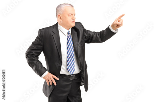 Photo: Angry mature man gesturing with finger Angry mature man gesturing with finger