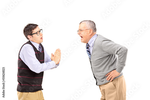 Photo: Mature man shouting at a man who is begging Mature man shouting at a man who is begging