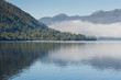 early morning mist over lake Brunner